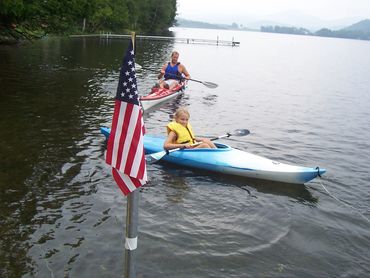 A man and a toddler doing river rafting
