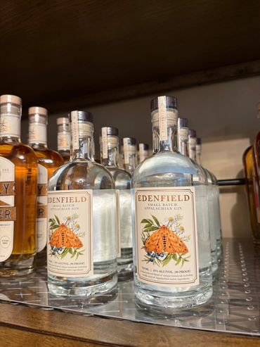 Bottles of Edenfield Appalachian Gin displayed on a shelf.