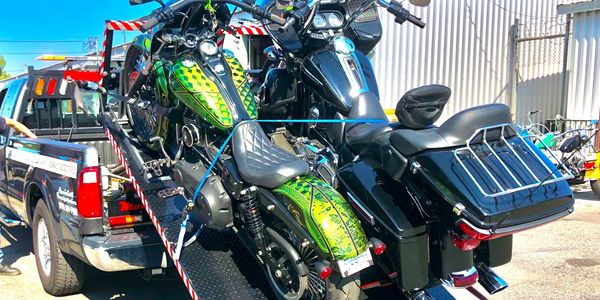 Custom motorcycle transport in a custom truck using EZ4U transport hydaulic flatbed tow service