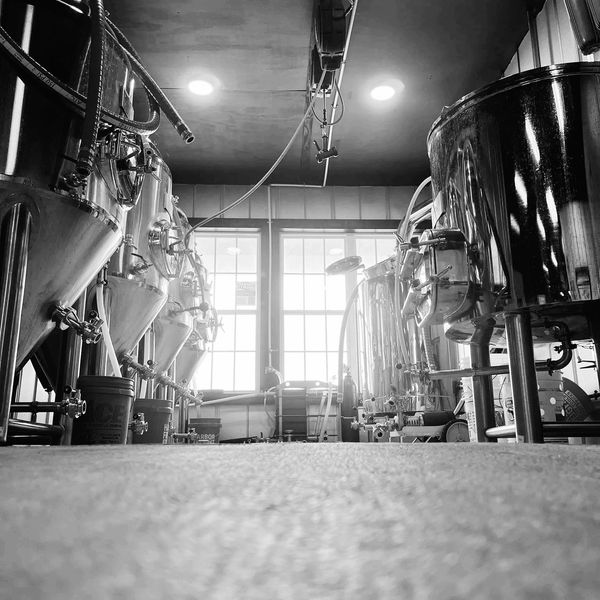 black and white photo of brewery equipment