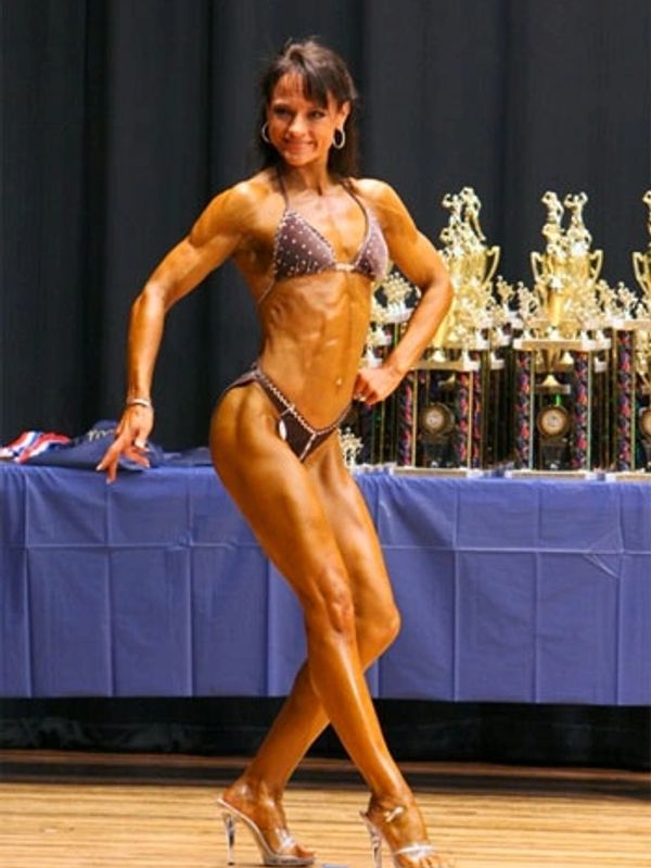 a woman in bikini showing her fit body