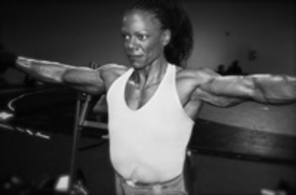 a woman is working out in the gym