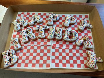 Letter donuts spelling Happy Birthday for special occasion