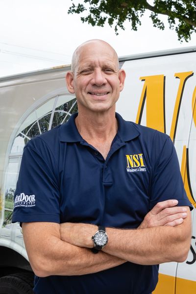 A Man In A Blue Color Shirt