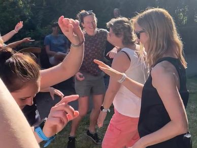 Dancing women enjoying the benefits of a laughter yoga session with Elspeth Fimpel.