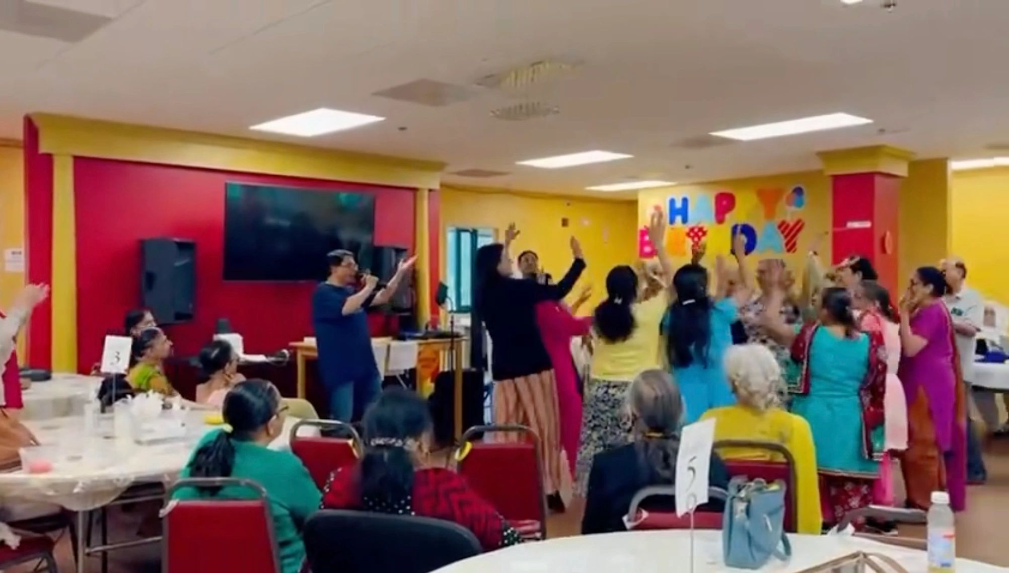 Seniors at adult day care center dancing to karaoke singing. Seniors at adult day care center dancing to karaoke singing.