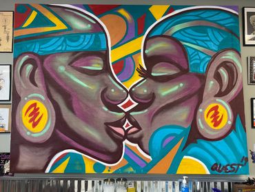 Colorful mural of two faces about to kiss, vibrant and expressive.