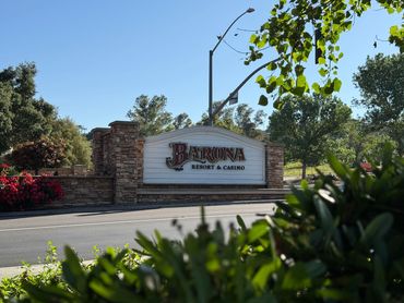 Entrance sign for Barona Resort & Casino surrounded by greenery.