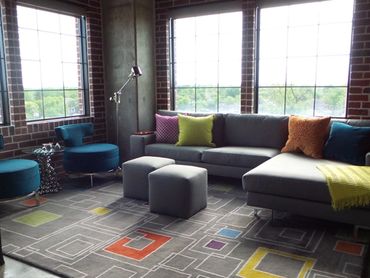 living room, colorful, grey couch, modern, exposed brick , loft, grey couch , interior design , pop