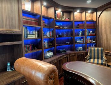 custom bookcase , desk, wood paneling, blue light, traditional , interior design