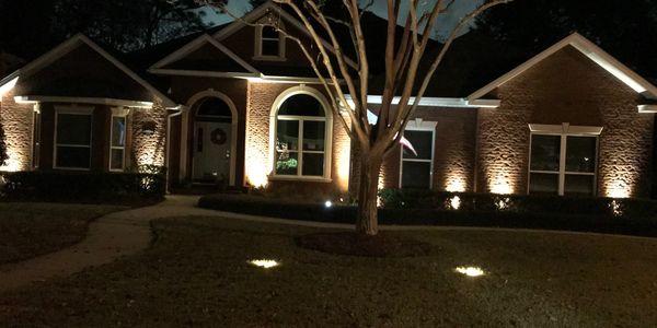Warm lights on house and trees