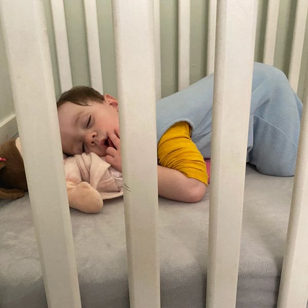 A child sleeping in a crib