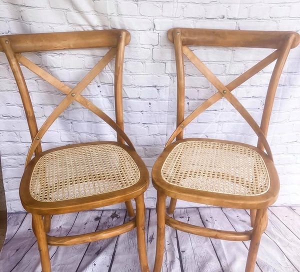restored wooden chairs with custom caned seats.
