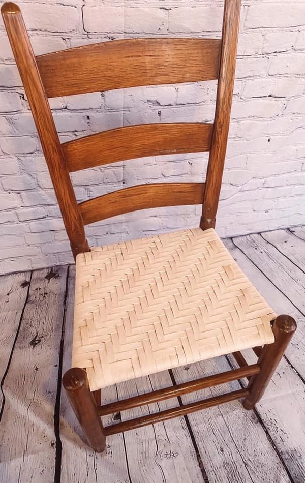 Image of a repaired chair with newly caned seat.
