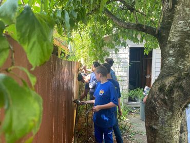 Scouts I led giving the fence a much needed coat of paint