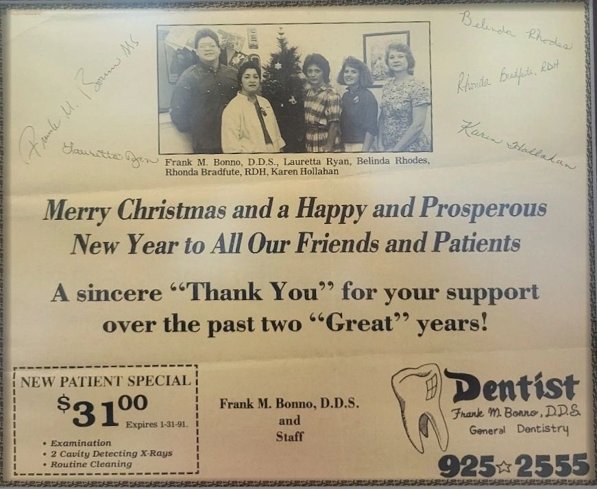 1990 newspaper coupon with vintage photo clipping of staff standing in front of Christmas tree.