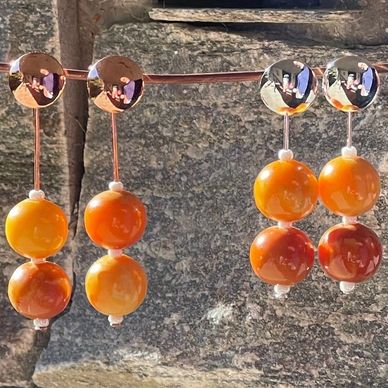 reworked amber beads on copper and silver earrings