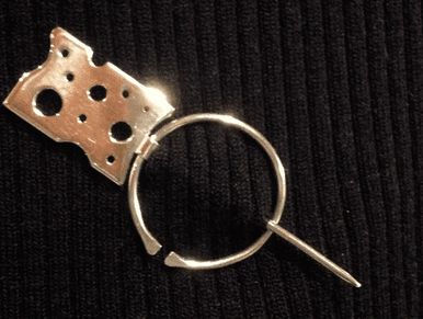 solid sterling silver penannular brooch shown worn