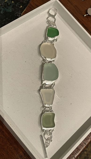 Solid fine and sterling silver bracelet with sea glass as  stones.