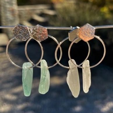 2 pairs of solid sterling silver earrings with white or blue sea glass on silver ring