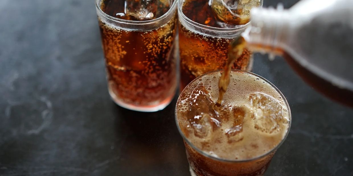 Three iced adult beverages mixed with cola