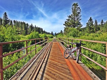 bicycle mountain bike, trail along river, hiking trail, adventure Idaho