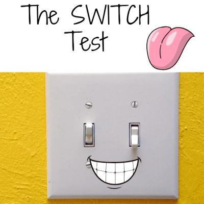 A light switch with a smiling face and text 'The SWITCH Test'.
