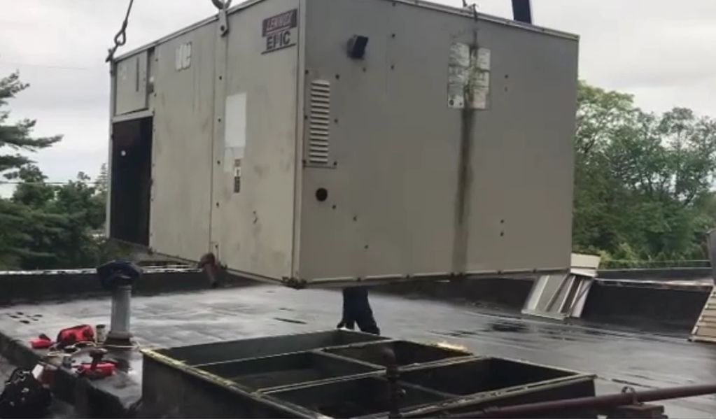 In this photo we utilize crane support to remove a commercial rooftop unit to install a new one!