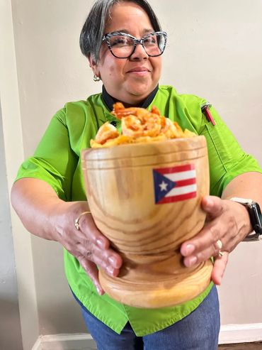 Chef Ive Adorno offering you a mofongo with shrimps