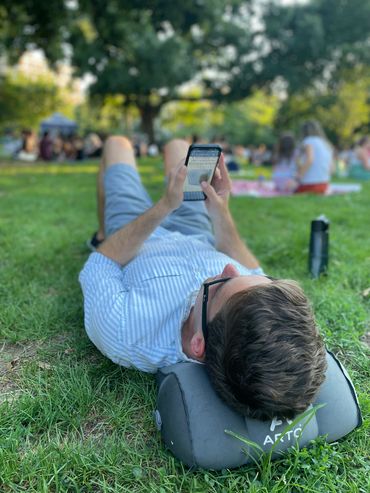 Arto Pillow - Inflatable being used in a crowded park.