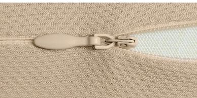 Unzipping the Arto Pillow - Memory Foam's outer cover, showing the innter cover.
