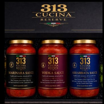 Three jars of 313 Cucina Reserve Italian sauces: Marinara, Vodka, and Arrabbiata.