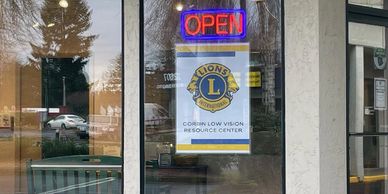 Front door of Low Vision Resource Center  with open sign
