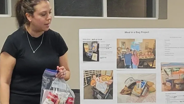 woman holding zip lock bag of ready to prepare food