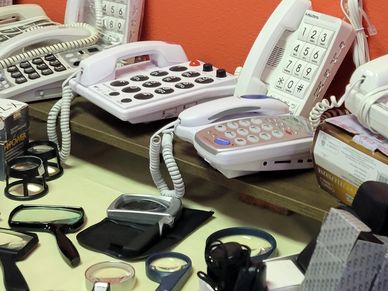 Large dial telephones and magnifying glasses at the Low Vision Resource Center in Olympia WA