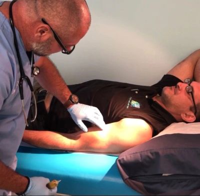 Dr. Mackey helping men explore hormone therapy options in South Florida