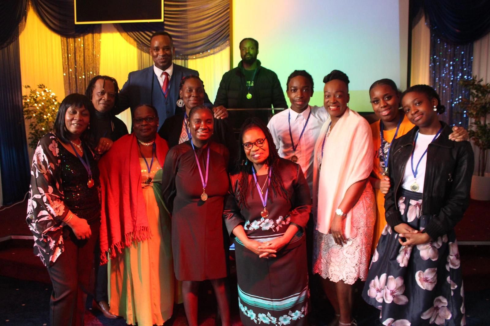 Members of Word Life pose for a picture with their 'Appreciation Day' medals. December 2020.