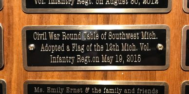Our plaque added to the donor board at the Flag Vault in Lansing, Michigan.