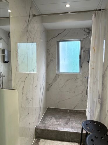 One of the three cozy and clean shower room