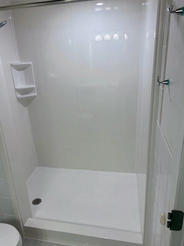 Bathroom renovation with custom shower base and panels