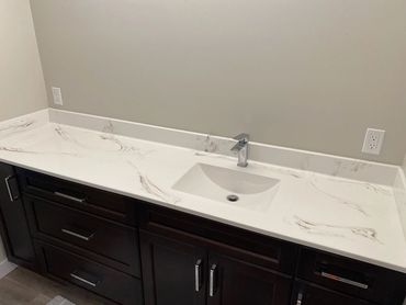 Bathroom renovation with a bold cultured marble vanity top