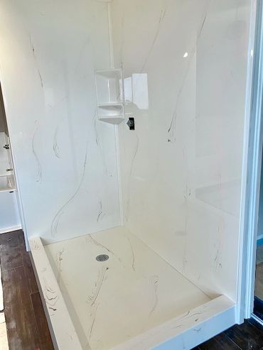 Double entry cultured marble shower base and shower panels