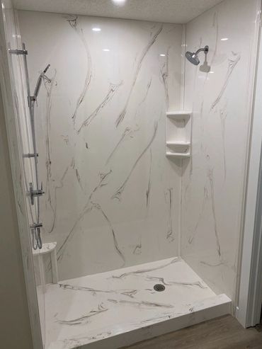 Bathroom renovation with a bold cultured marble shower