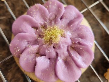 homemade sugar cookie with homemade buttercream icing flower design