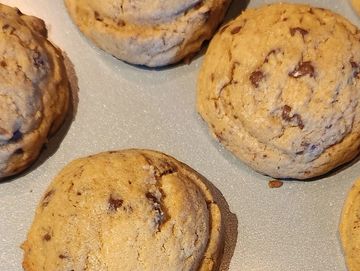 homemade rich, chewy chocolate chip cookes warm from the oven