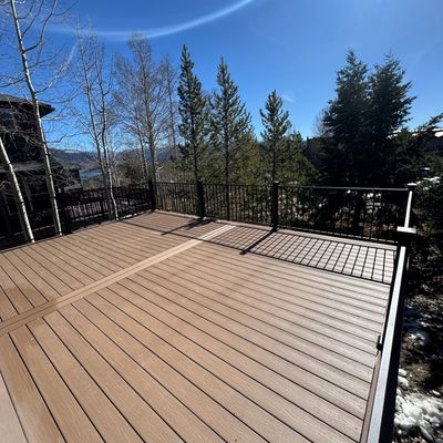 Custom composite deck built in Centennial, Colorado by Global Cooperation LLC with modern railing.