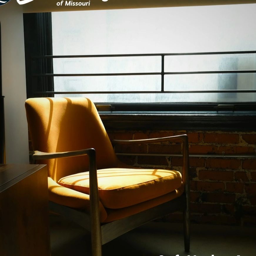 Sunlit chair beside a window in a quiet room