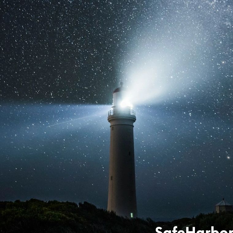 Lighthouse under a starry sky