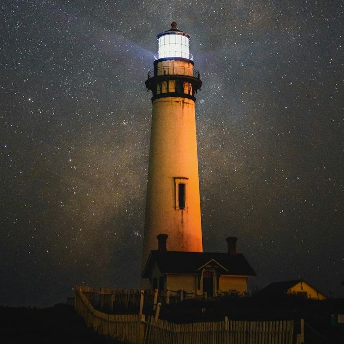 Lighthouse under a starry sky