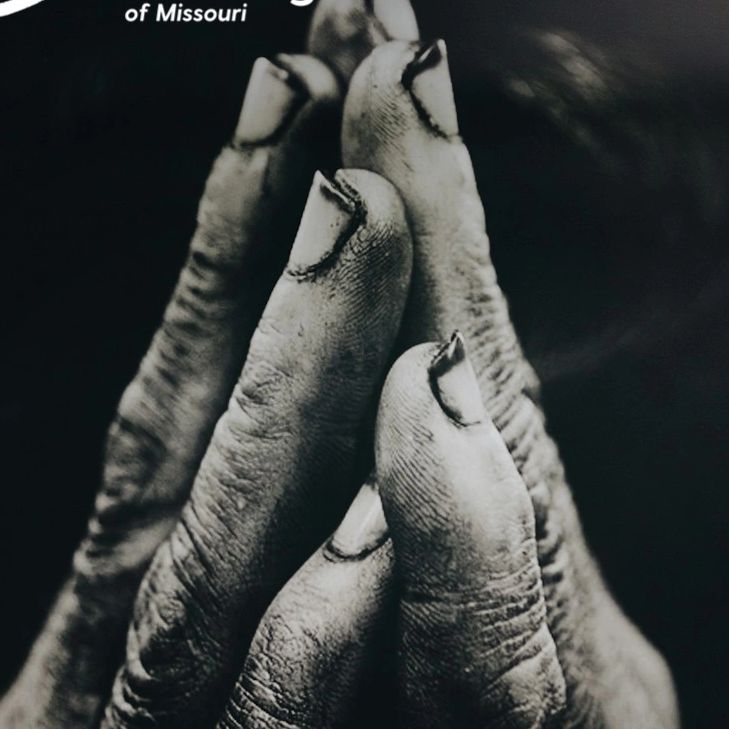 Black-and-white of hands clasped symbolizing resilience, inner struggle, and the pursuit of healing.